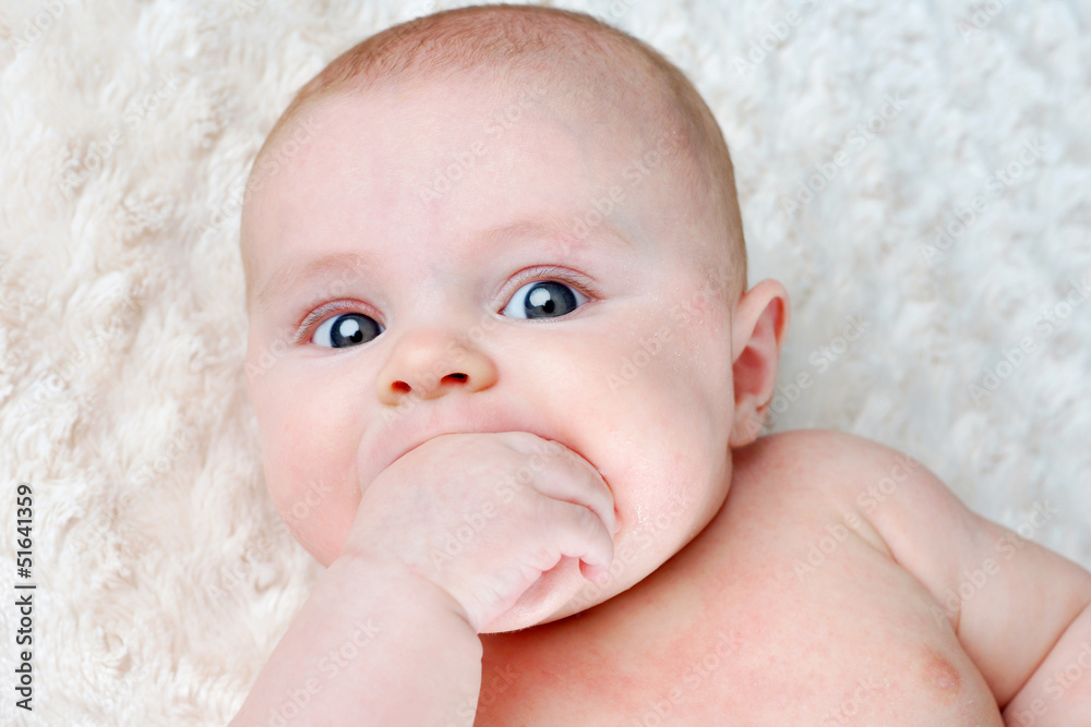 Baby sucking on its hand Baby sucking on its hand