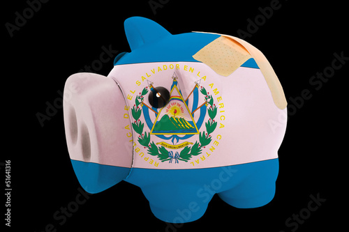 bankrupt piggy rich bank in colors of national flag of el salvad photo