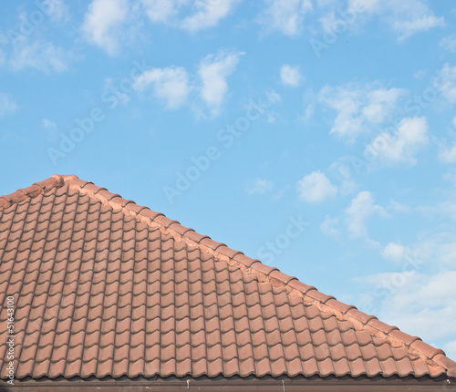 Roof tiles under blue sky