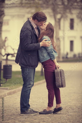 Young couple kissing on the street © Masson