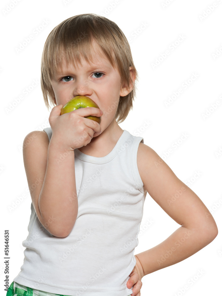 Portrait of a little boy eating an apple Portrait of a little boy eating an apple