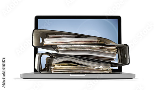ring binders on computer - database concept, clipping path inclu photo