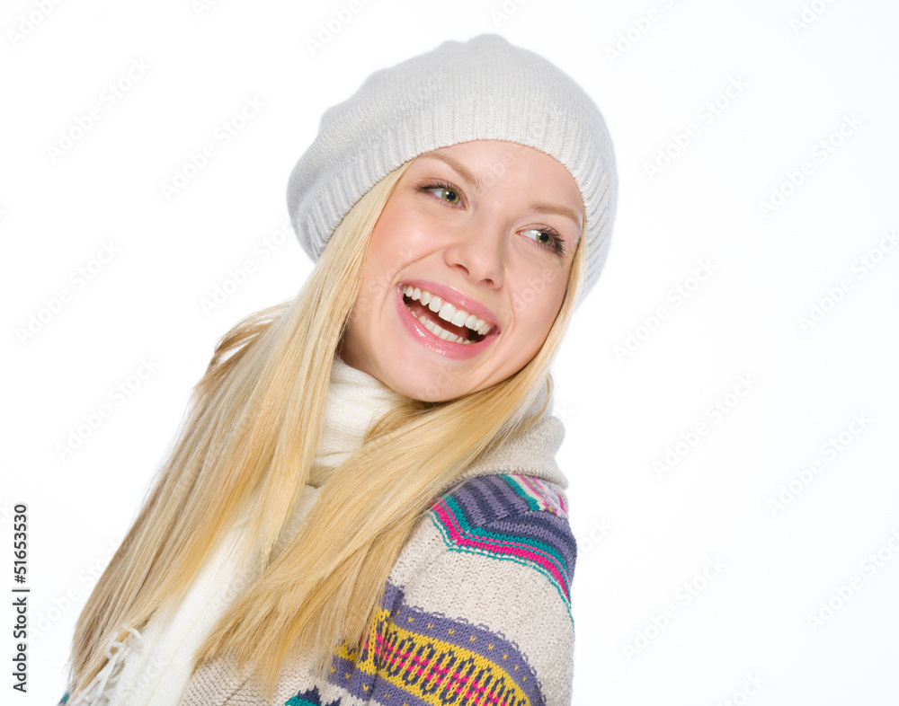 Portrait of smiling girl in winter clothes looking on copy space Portrait of smiling girl in winter clothes looking on copy space