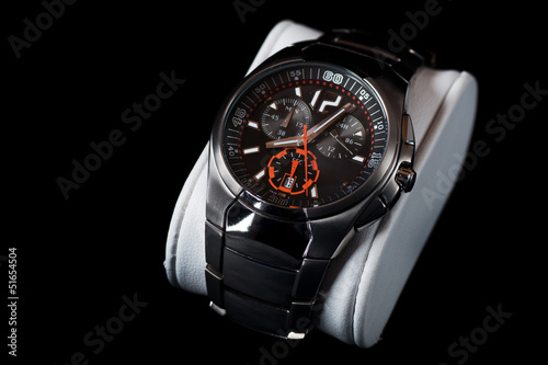 Men's metalic wristwatch, isolated on black background