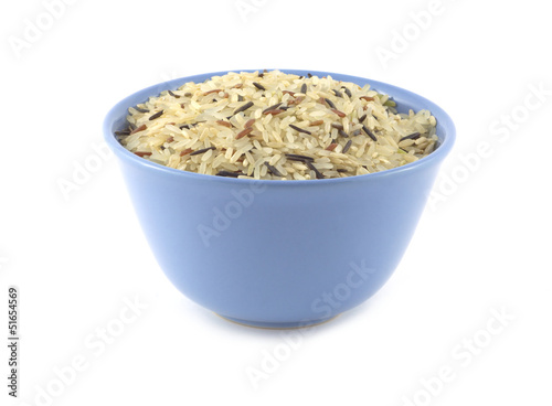 China color rice in blue bowl isolated on white closeup