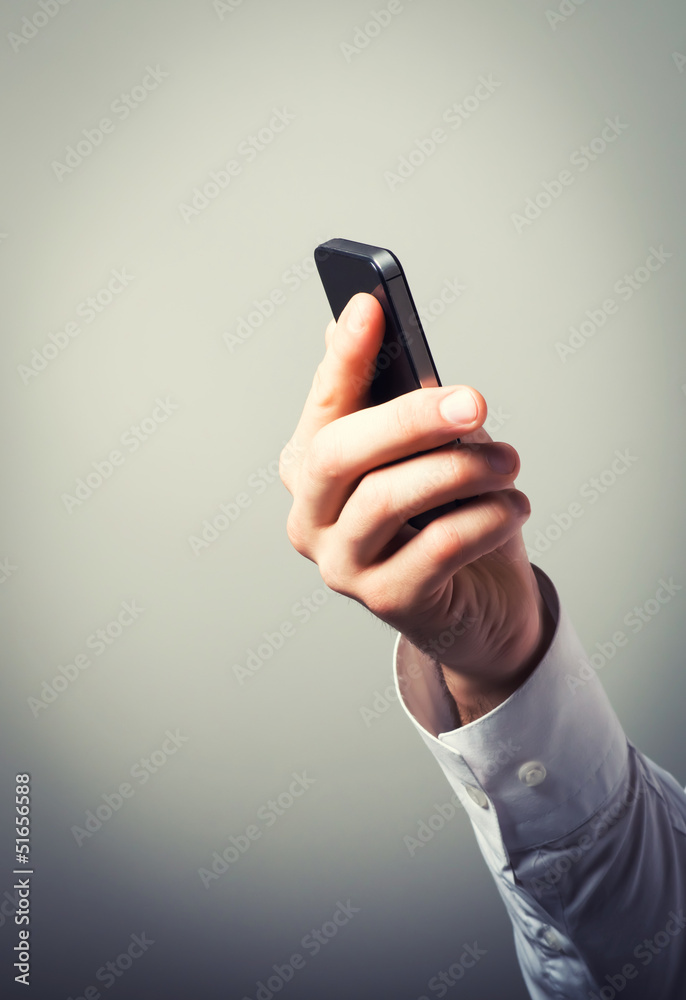 Fototapeta premium Businessman using smartphone