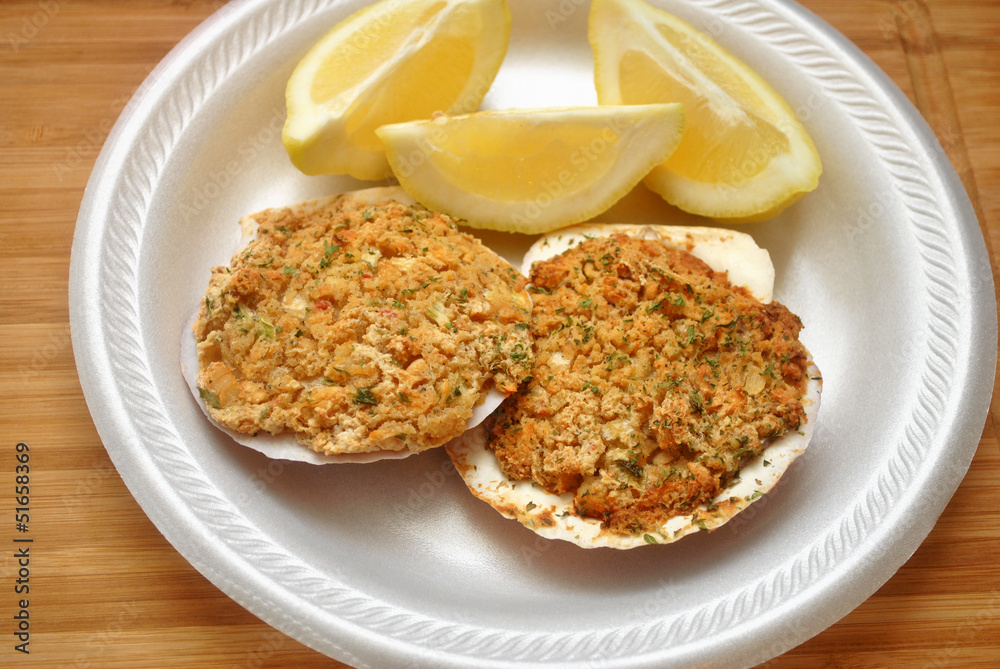 Two Stuffed Scallops with Three Lemon Slices Two Stuffed Scallops with Three Lemon Slices