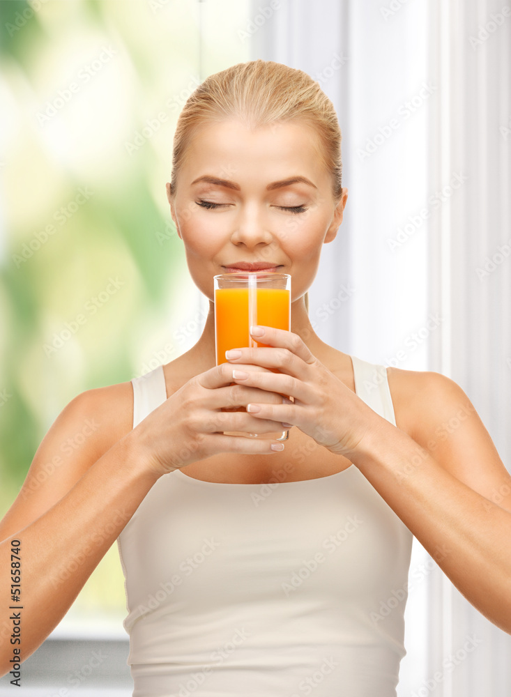 young woman drinking orange juice young woman drinking orange juice