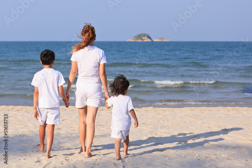 Asian family on beach