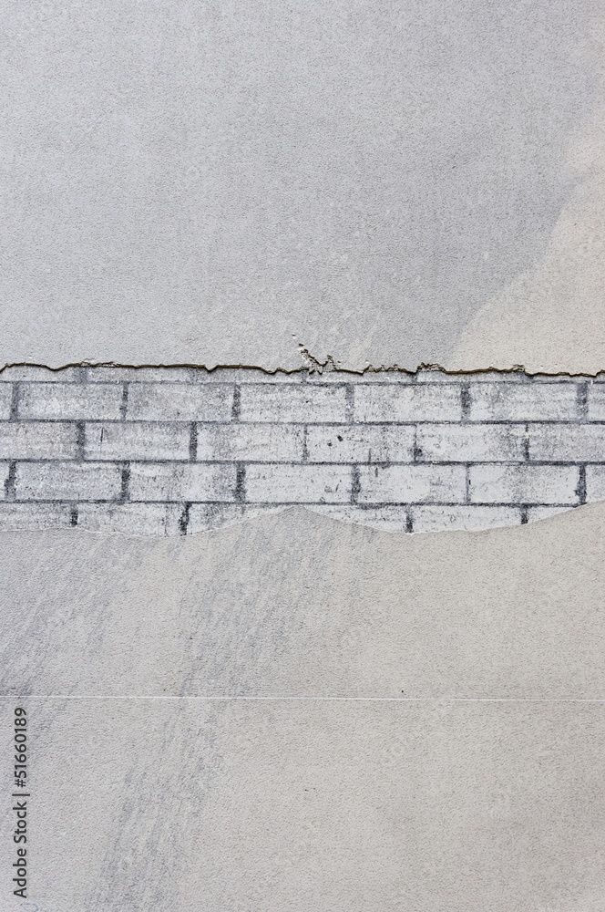 mur abimé briques apparentes sous l