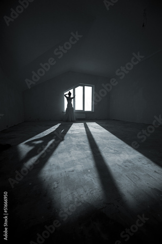 Young bride on the empty room