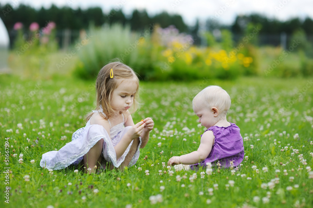 Two sisters playing outside
