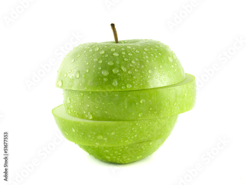 Isolated green apple slices with water drops