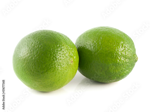 Isolated two green limes on a white background