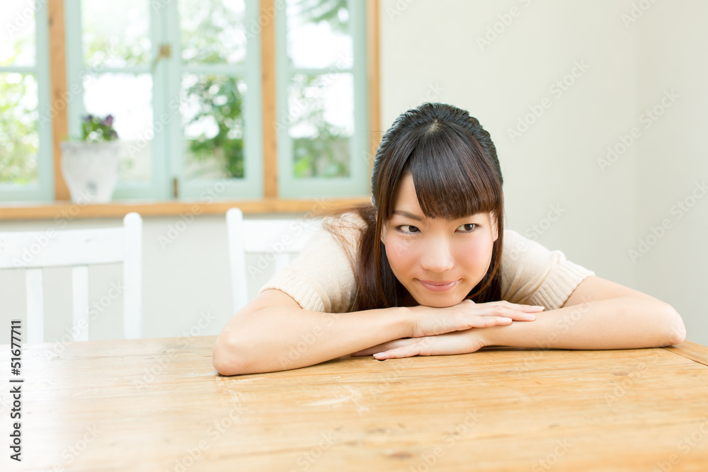 Beautiful young woman relaxing in the garden Beautiful young woman relaxing in the garden