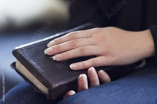 Women Holding a Bible