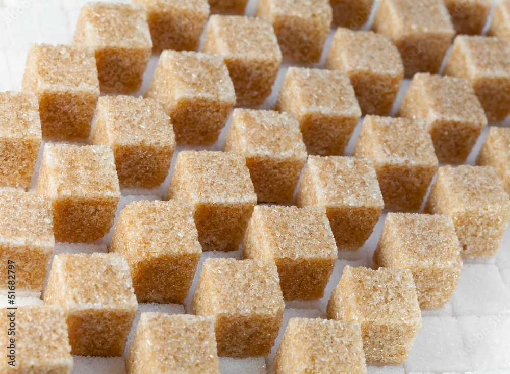 Cubes of not refined reed sugar and white sugar.. Cubes of not refined reed sugar and white sugar..