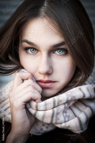 Portrait of a young woman with beautiful blue eyes. Soft focus.