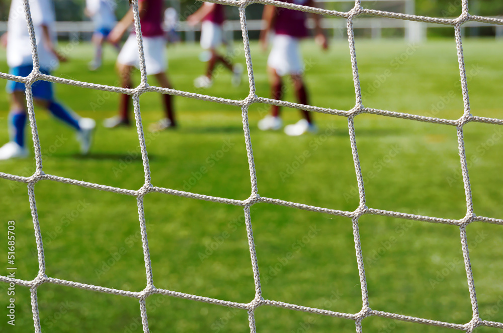 Fototapeta premium football net with some players