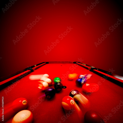 Billards pool game. Breaking the color ball from triangle photo