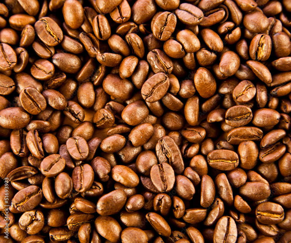 Naklejka premium Brązowa kawa, tekstura tło. palona kawa ziarnista. Brown co