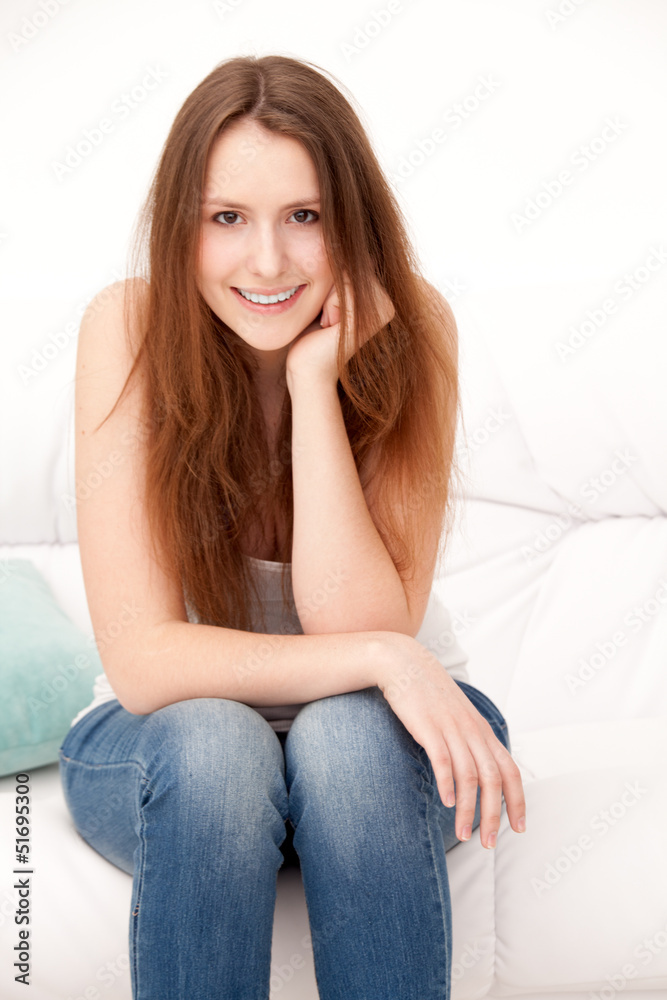 woman sitting on sofa woman sitting on sofa