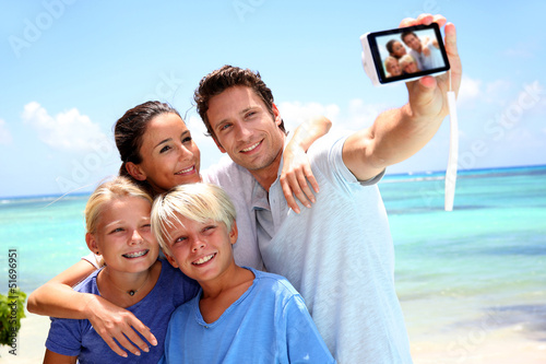 Couple and children taking family picture