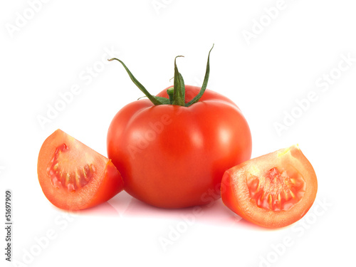 Isolated red tomato with two slices on a white