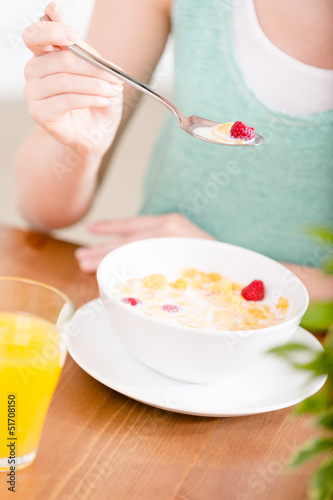 Close up view of plate with cereals and strawberry