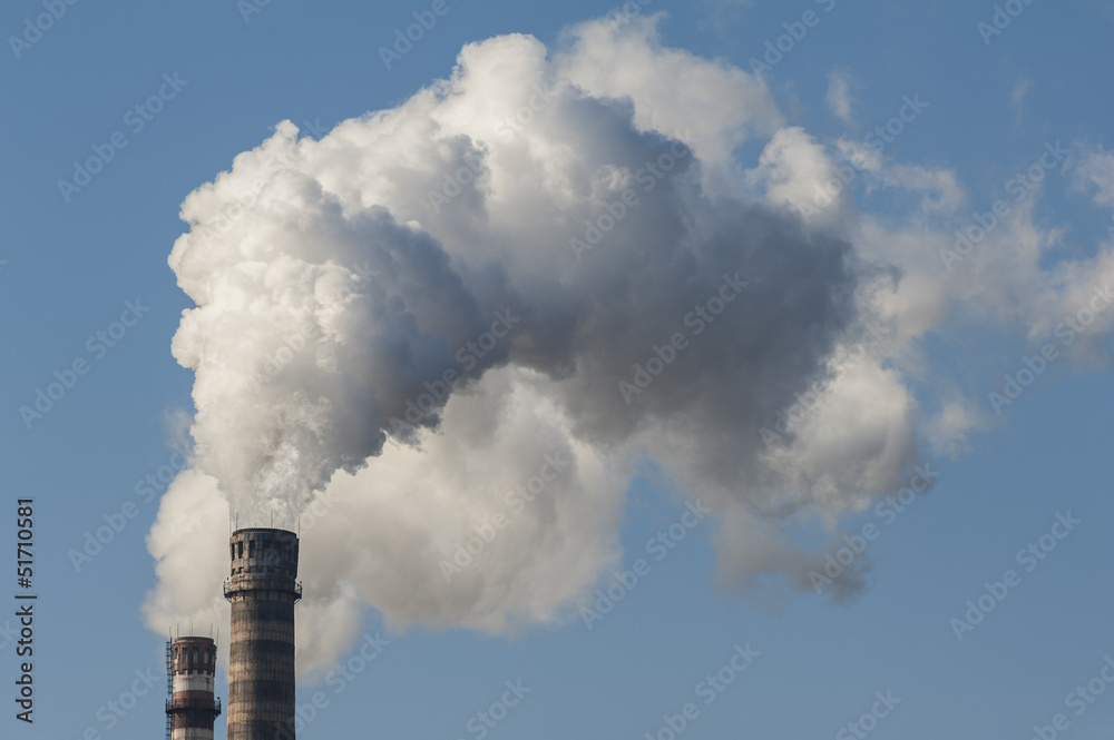 Volumes of white smoke poured from the chimney.