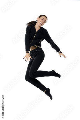 Girl in black dress jumping, isolated