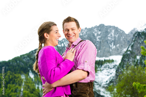 Happy couple in Alpine meadow © Kzenon
