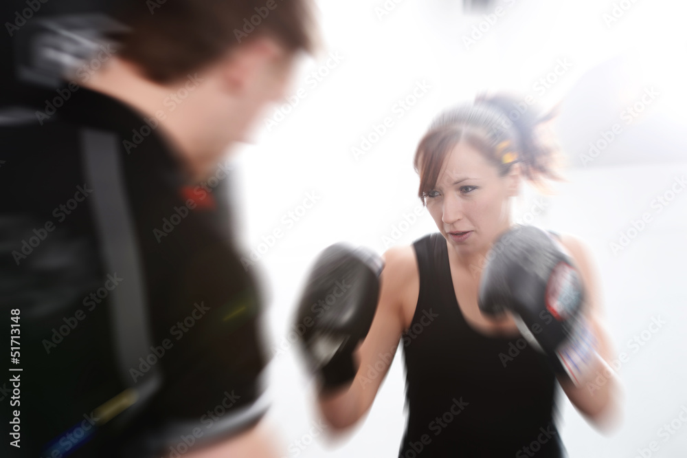 Fototapeta premium Action shot of girl with personal trainer