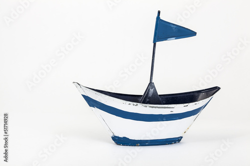 metal toy boat with flag
