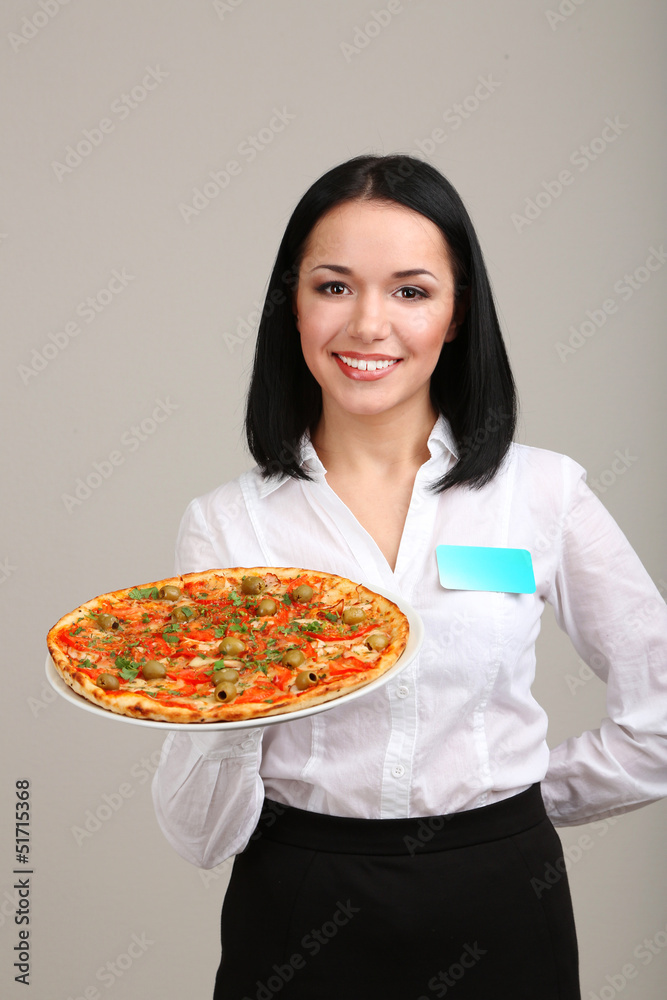 Beautiful girl waiter with pizza isolated on white Beautiful girl waiter with pizza isolated on white