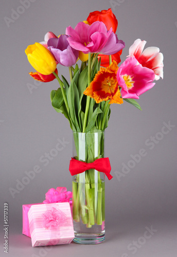 Wallpaper Mural Beautiful tulips in bouquet with gifts on gray background Torontodigital.ca