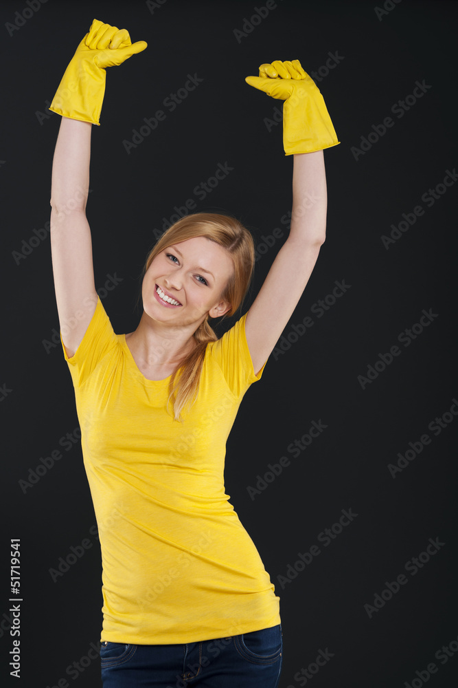 Happy woman with yellow protective glove Happy woman with yellow protective glove