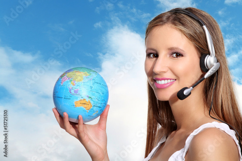 receptionist with headphones and globe photo