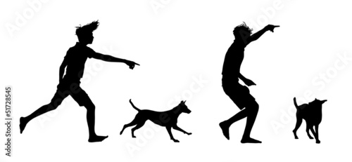 silhouettes of a boy playing with his dog