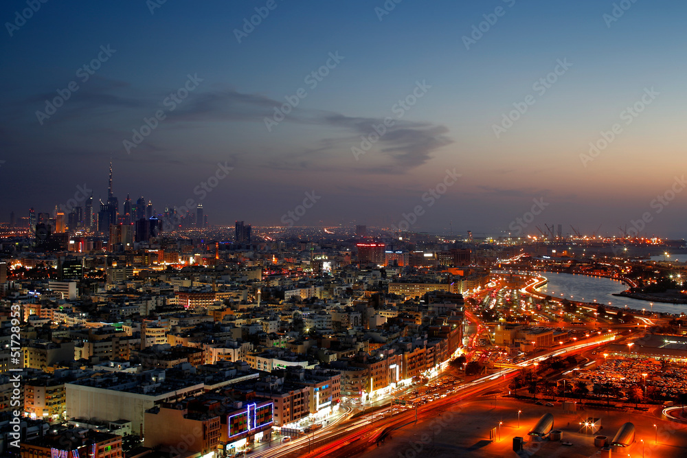 A skyline panorama of Dubai at dusk showing Deira and the Creek