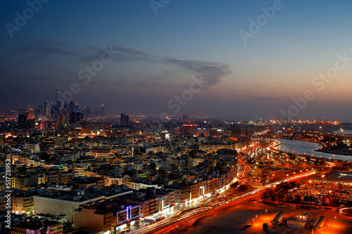 A skyline panorama of Dubai at dusk showing Deira and the Creek