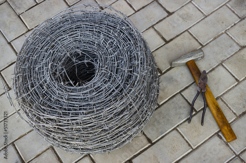 Bay of barbed wire and tool