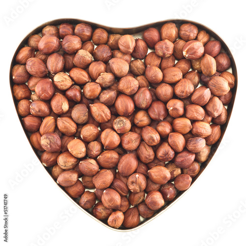 Heart shaped box full of hazelnuts