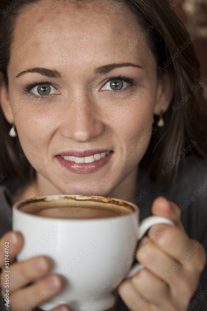 Young Woman with Beautiful Green Eyes with White Coffee Cup Young Woman with Beautiful Green Eyes with White Coffee Cup