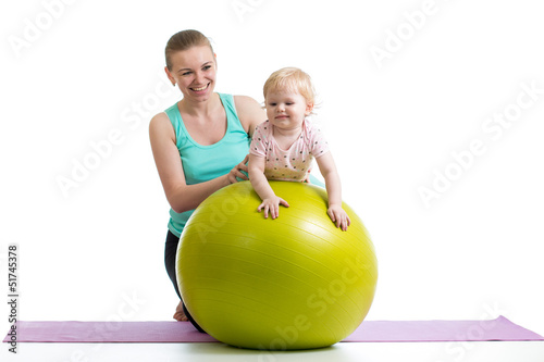 mother doing gymnastics wit...