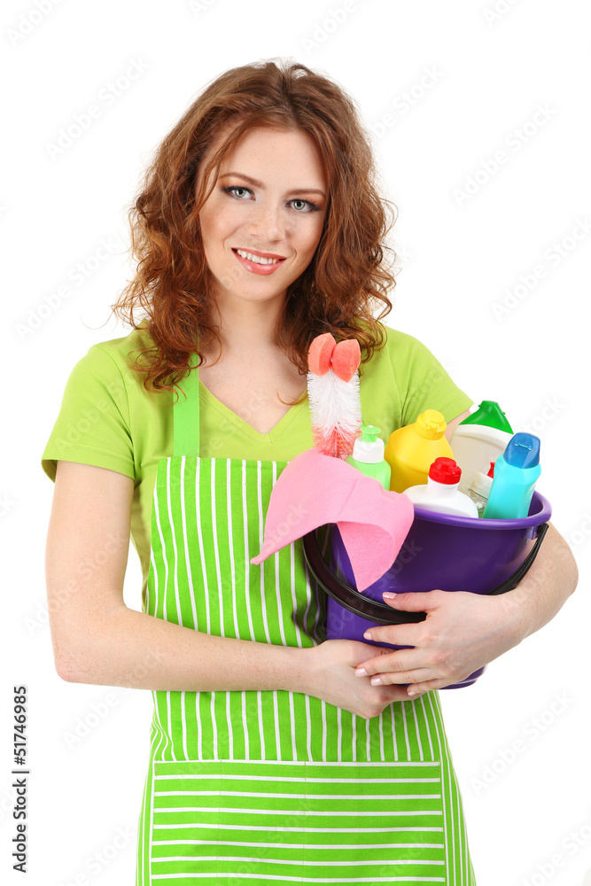Female cleaner holding bucket with cleaning supplies isolated Female cleaner holding bucket with cleaning supplies isolated