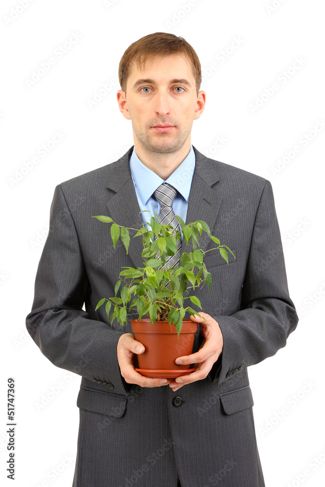 Young businessman with plant isolated on white. Young businessman with plant isolated on white.