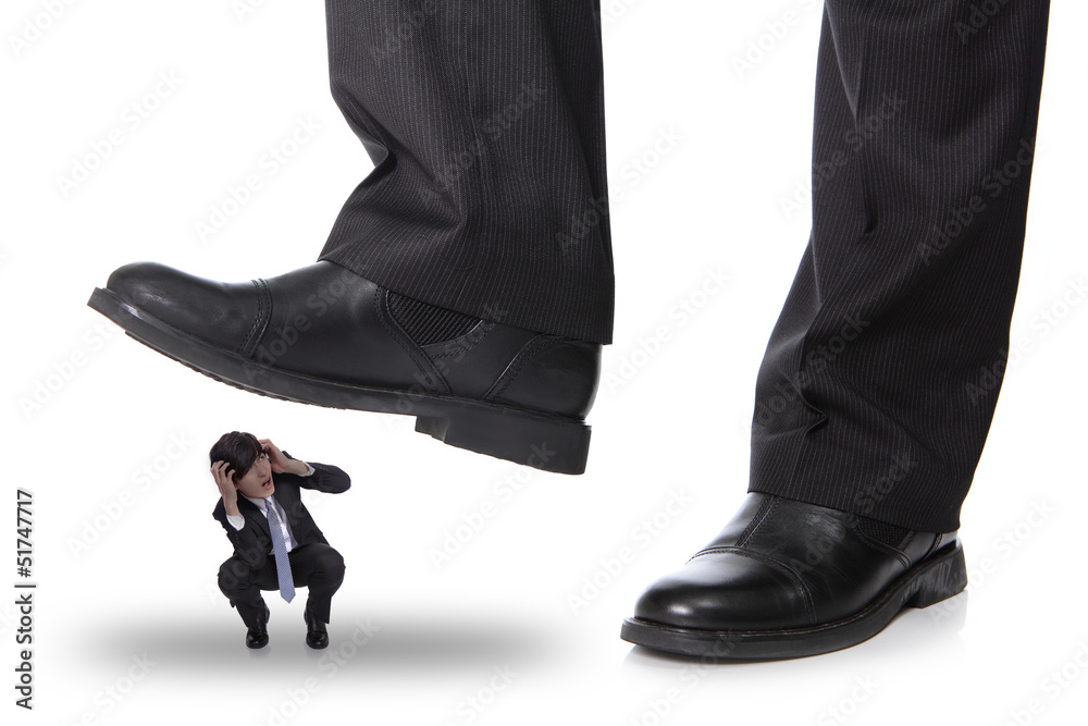 business man steping on a fear man business man steping on a fear man