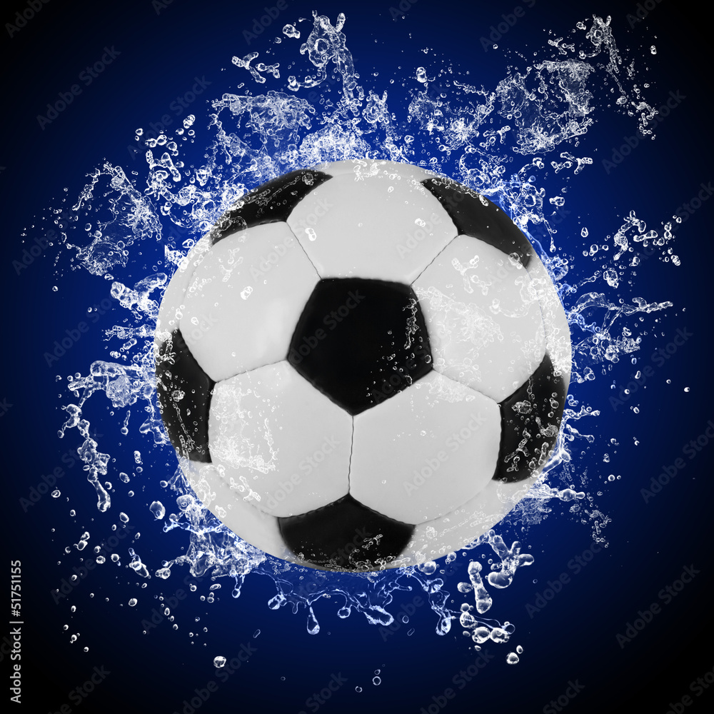 Soccer ball in splashing water