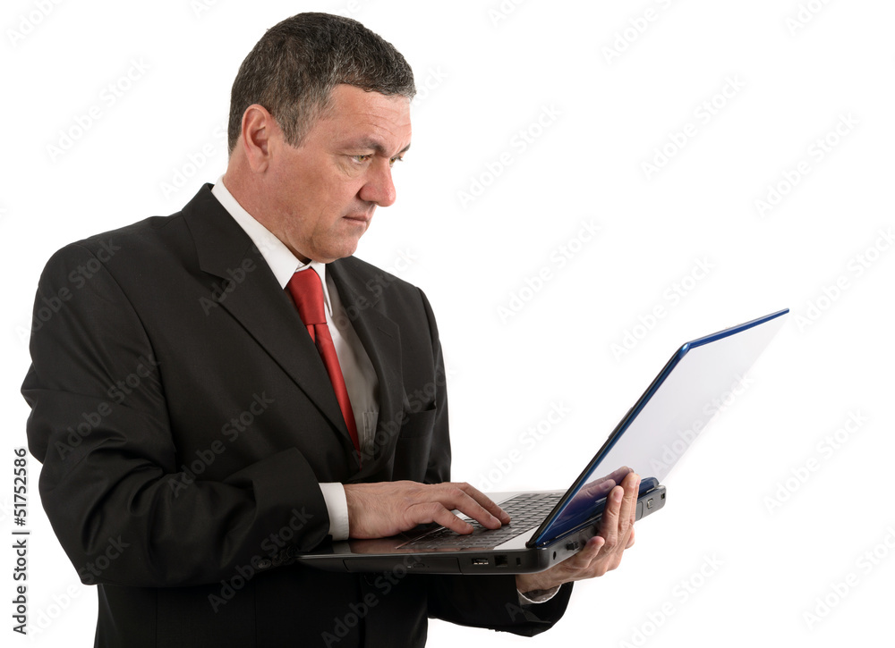 Older businessman with a laptop isolated on white background Older businessman with a laptop isolated on white background